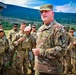 Army Col. Wilson Rutherford speaks to his troops in the field