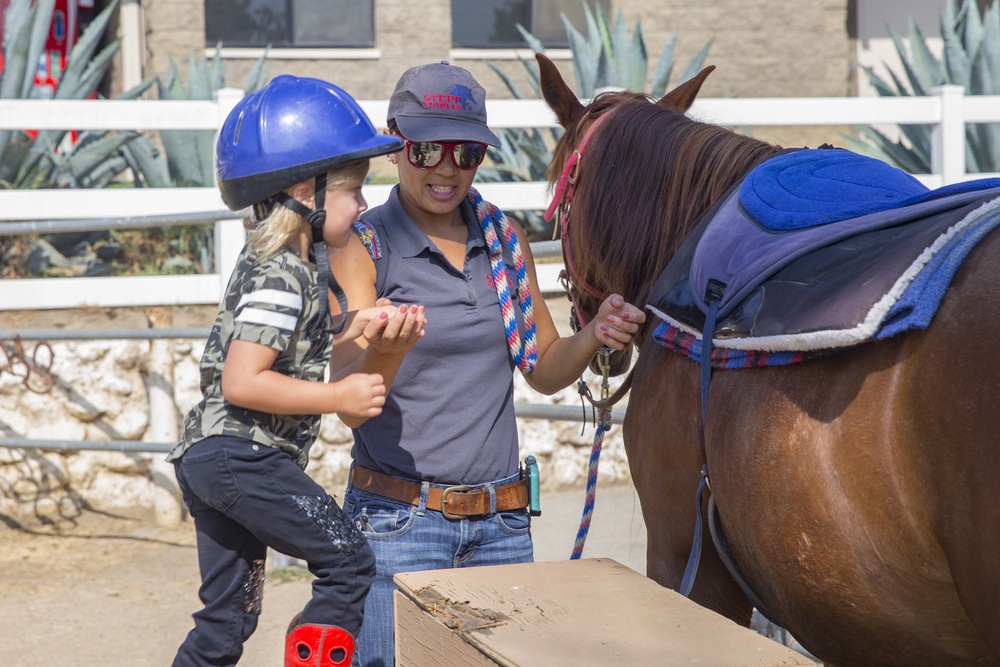 Kids learn to ride horses at Stepp Stables