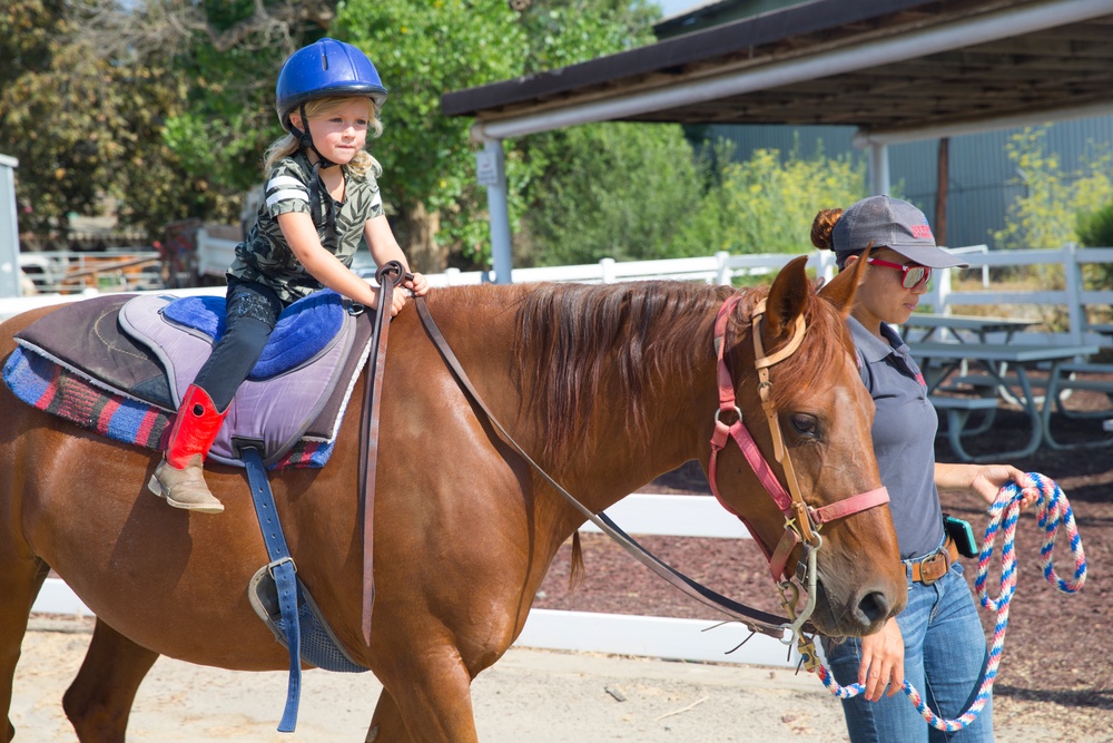 Kids learn to ride horses at Stepp Stables