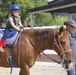 Kids learn to ride horses at Stepp Stables