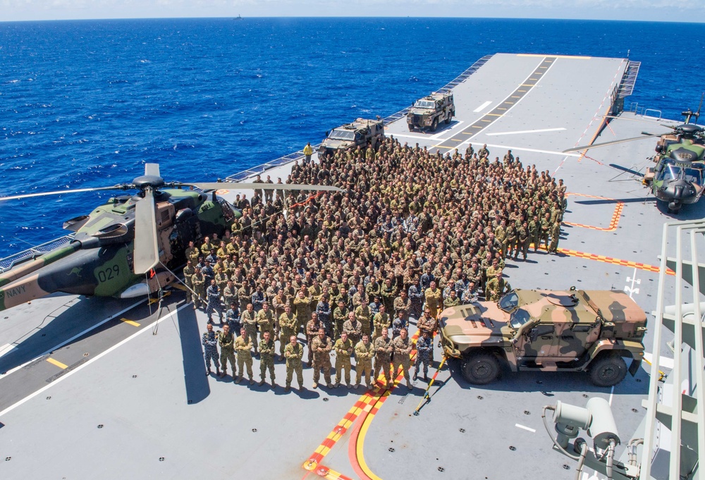 HMAS Adelaide, embarked forces from five countries gather for group photo during RIMPAC 2018