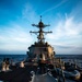USS Dewey sails at sunset during RIMPAC 2018