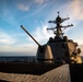 USS Dewey sails at sunset during RIMPAC 2018