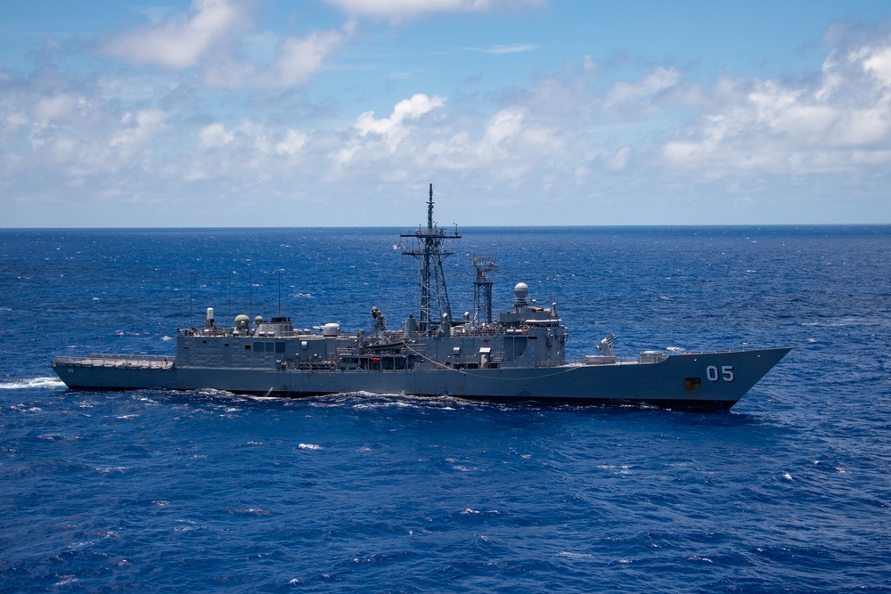 HMAS Melbourne sails with partner nations during RIMPAC