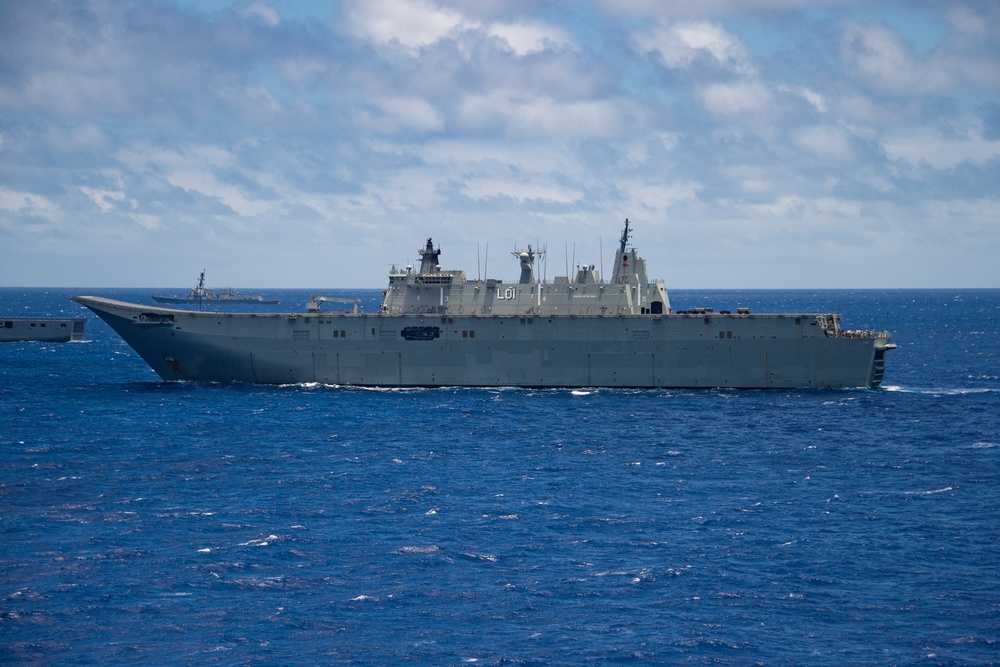 HMAS Adelaide sails with partner nations during RIMPAC