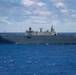 HMAS Adelaide sails with partner nations during RIMPAC