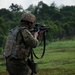 Charlie Company, 100th Infantry Regiment, storms the objective on a live fire range