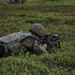 Charlie Company, 100th Infantry Regiment, storms the objective on a live fire range