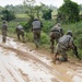 Charlie Company, 100th Infantry Regiment, storms the objective on a live fire range