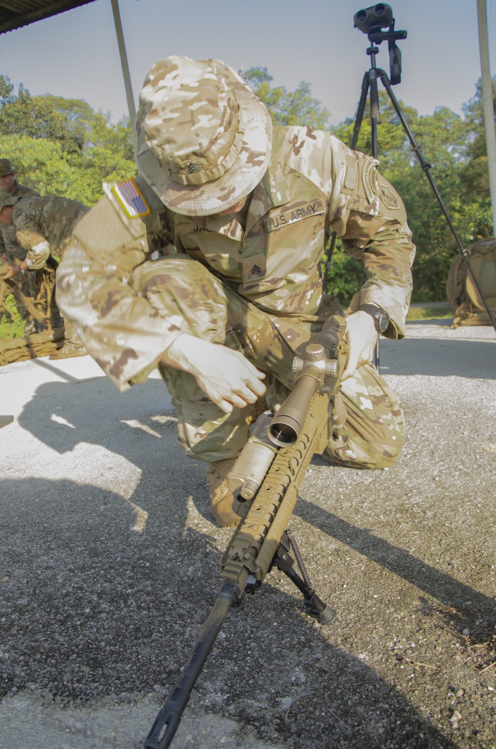 Charlie Company, 100th Infantry Regiment, storms the objective on a live fire range