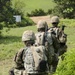 Charlie Company, 100th Infantry Regiment, storms the objective on a live fire range Spc. Alec Dionne