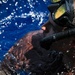 Sailors and Military Sealift Command civil service mariners participate in a swim call aboard the USS Mount Whitney (LCC 20) in in the Mediterrranean Sea.