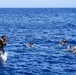 Sailors and Military Sealift Command civil service mariners participate in a swim call aboard the USS Mount Whitney (LCC 20) in in the Mediterrranean Sea.