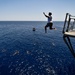 Sailors and Military Sealift Command civil service mariners participate in a swim call aboard the USS Mount Whitney (LCC 20) in in the Mediterrranean Sea.