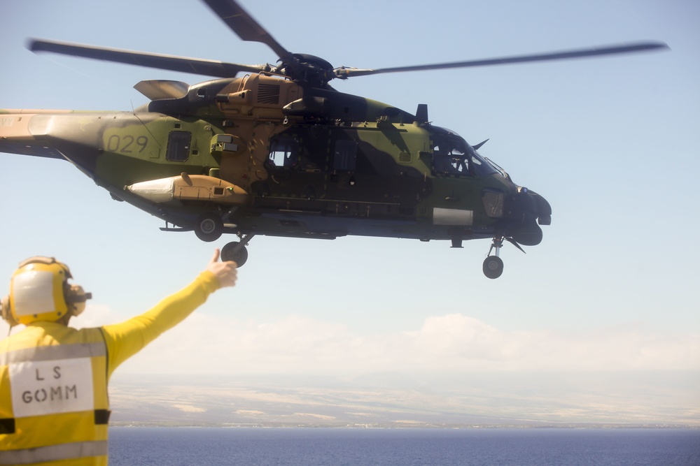 Australian Army pilots conduct touch down ops aboard HMAS Adelaide