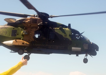 Australian Army pilots conduct touch down ops aboard HMAS Adelaide