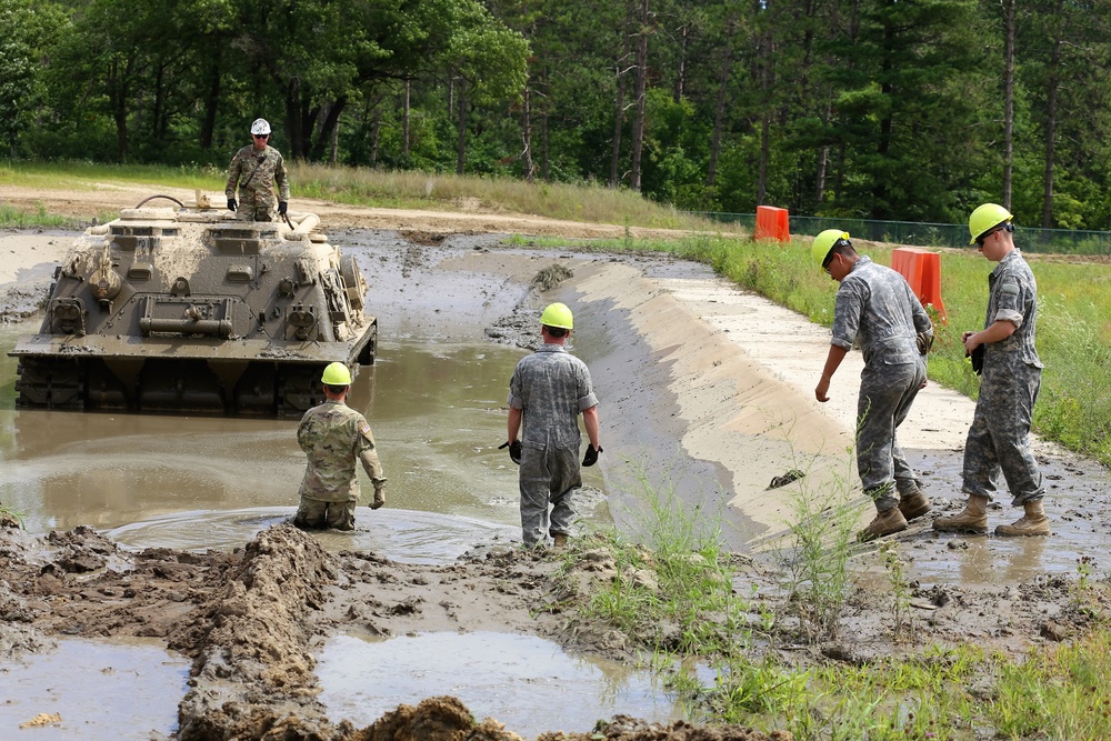 Students build skills in tracked vehicle recovery during RTS-Maintenance course at Fort McCoy