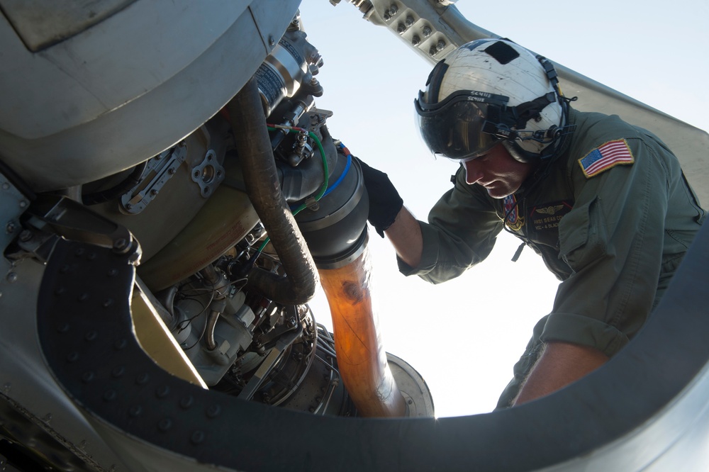 HSC-4 Aircrewman conducts engine inspection