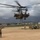 CH-53 transports howitzer during RIMPAC amphib landing demo
