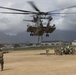CH-53 transports howitzer during RIMPAC amphib landing demo