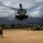 CH-53 transports howitzer during RIMPAC amphib landing demo