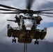 CH-53 transports howitzer during RIMPAC amphib landing demo