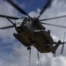 CH-53 transports howitzer during RIMPAC amphib landing demo