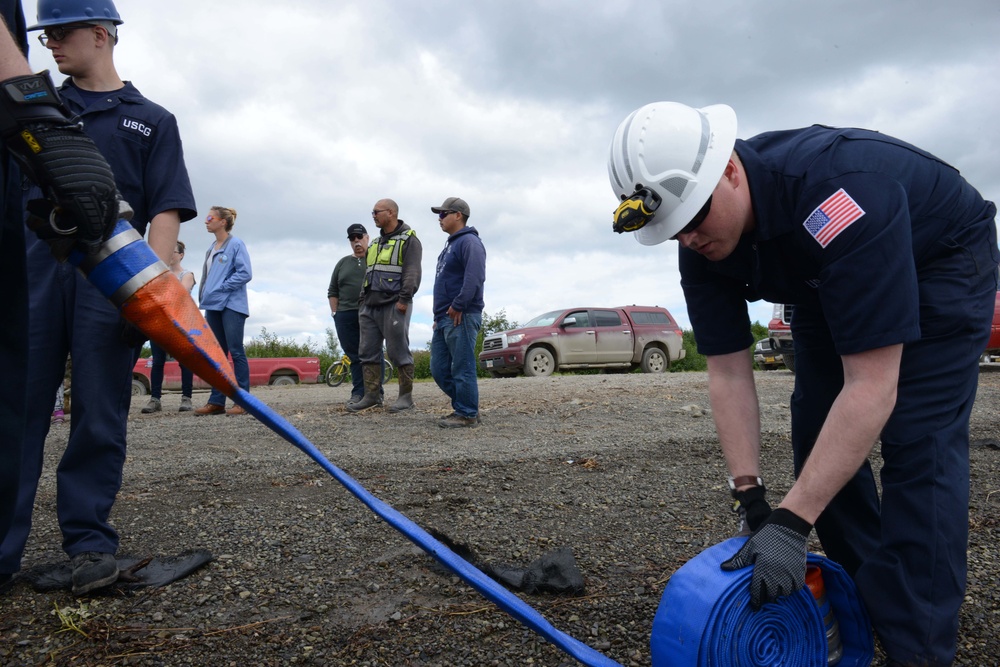 Coast Guard personnel assist with oil spill response demonstration
