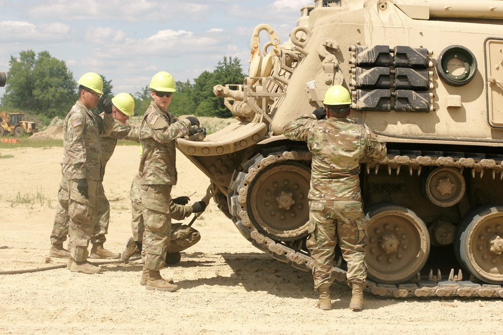 Students build skills in tracked vehicle recovery during RTS-Maintenance course at Fort McCoy