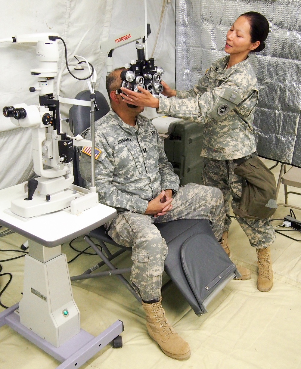 U.S. Army Reserve Soldier Capt. Amy Dao with 315th Optometry Medical Detachment, based in Fort Dix, N.J, prepares for an eye exam during Global Medic CSTX 91-18-01, at Fort Hunter Liggett, California, July 21, 2018. CSTX 91-18-01