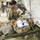 U.S. Army Reserve Soldiers with 228th Combat Support Hospital, based out of San Antonio, Texas, provide medical care for a simulated patient in a surgical cut suit during Global Medic CSTX 91-18-01, at Fort Hunter Liggett, California, July 21, 2018.