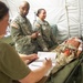 U.S. Army Reserve Soldiers assigned to 228th Combat Support Hospital, based out of San Antonio, Texas, provide medical care for a simulated patient during Global Medic CSTX 91-18-01