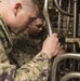 Sailors do maintenance on the Ohio-class ballistic submarine USS Alaska