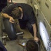 Sailors do maintenance on the Ohio-class ballistic submarine USS Alaska