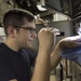 Sailors do maintenance on the Ohio-class ballistic submarine USS Alaska