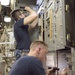 Sailors do maintenance on the Ohio-class ballistic submarine USS Alaska