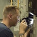 Sailors do maintenance on the Ohio-class ballistic submarine USS Alaska