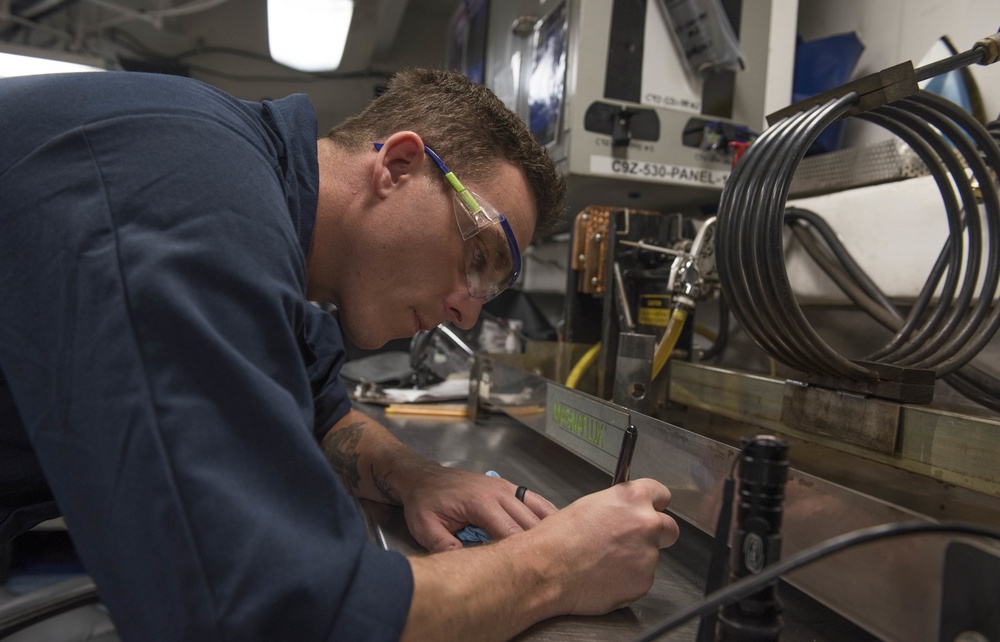 Aviation Structural Mechanic Conducts Magnetic Particle Inspection