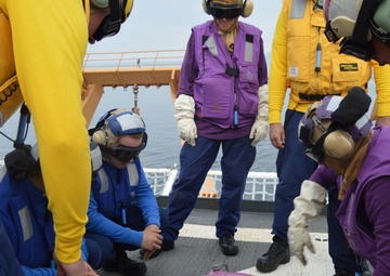 Coast Guard Cutter Healy crew members train to refuel helicopters