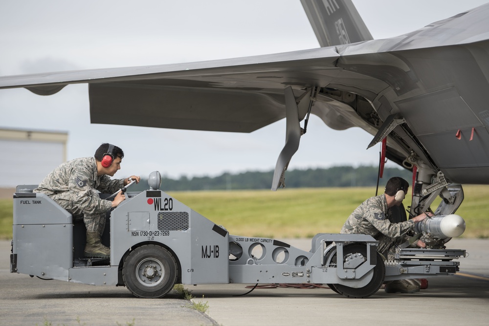 Airmen conduct weapons load at JBER