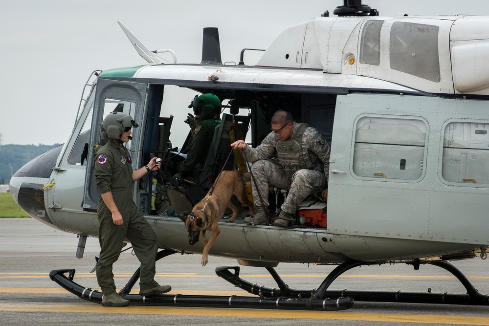 374th MWD's Fly With the 459th Airlift Squadron