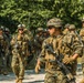 Marines dismounts maneuvering to an objective