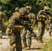 Marines dismounts maneuvering to an objective