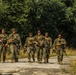 Marines dismounts maneuvering to an objective
