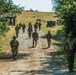 Marines dismounts maneuvering to an objective