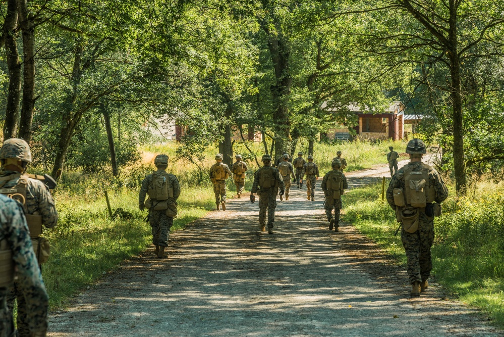 Marines dismounts maneuvering to an objective