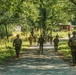 Marines dismounts maneuvering to an objective