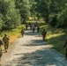 Marines dismounts maneuvering to an objective