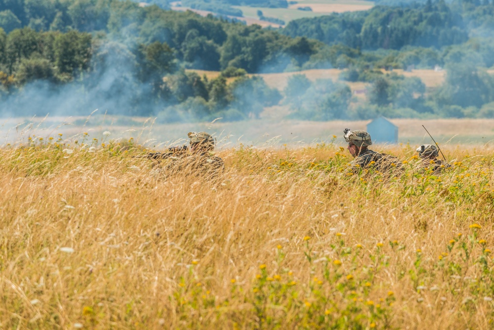 Marines dismounts maneuvering to an objective