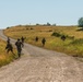 Marines dismounts maneuvering to an objective